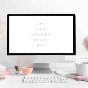 May include: A white desktop computer with a blank screen displaying the text "ADD YOUR SCREENSHOT OR TEXT HERE". The computer is on a white desk with a keyboard, a phone, a cup of coffee, and two vases with pink flowers.