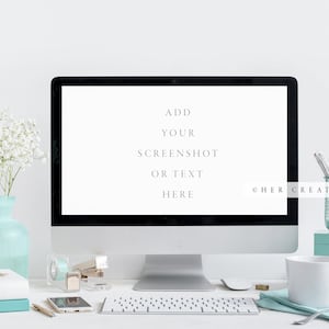 May include: A white desktop computer with a blank screen displaying the text "ADD YOUR SCREENSHOT OR TEXT HERE" and the copyright symbol followed by "HER CREATIVE STUDIO". The computer is on a white desk with a white keyboard, a white mug, a blue vase with white flowers, and other office supplies.