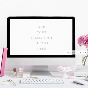 May include: A white desk with a computer monitor, keyboard, mouse, and other office supplies. The monitor has a white background with the text "ADD YOUR SCREENSHOT OR TEXT HERE". There are pink roses in a glass vase on the right side of the desk.