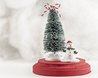 Snowman Tabletop Christmas Decoration, glittery bottlebrush tree paired with an acrylic statue, with Red and White Striped Bow