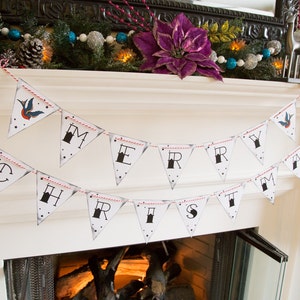 May include: A white banner with the words "MERRY CHRISTMAS" printed in black, strung on a red and white twine. Each pennant has a star design and a small tattoo-style bird illustration. The banner is displayed above a fireplace.