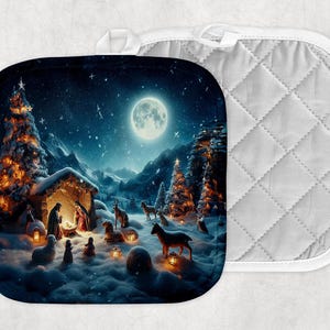 May include: A Christmas-themed oven mitt with a quilted design. The front features a snowy winter scene with a nativity scene, a starry night sky, and a glowing moon.