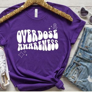 Overdose awareness shirt. Overdose awareness T-shirt. Overdose awareness tee. OD epidemic. Shirts for recovery. Recover out loud. Group walk