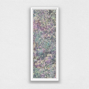 May include: Abstract art piece in a white frame. The artwork features a textured, multi-colored design with shades of purple, green, and gray. The rectangular piece is vertically oriented, creating a modern aesthetic.