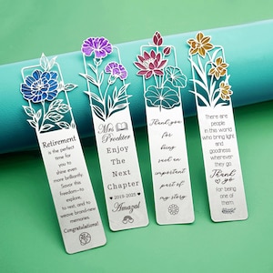May include: Four metal bookmarks with floral designs and text. The bookmarks feature blue, purple, pink, and yellow flowers. Text includes "Retirement," "Mrs. Prockter," and "Thank you." Each bookmark is approximately 15 cm long.