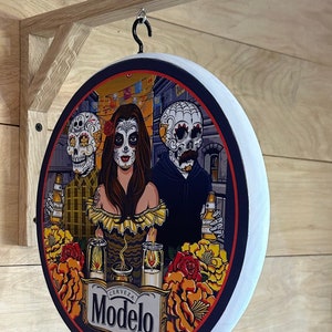 Modelo double sided pub sign - 12 inch diameter and includes wall hanging bracket