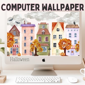 Puede incluir: Un monitor de computadora que muestra una ilustración digital en acuarela de una fila de casas coloridas con árboles de otoño, calabazas, murciélagos y un gato negro. El texto "COMPUTER WALLPAPER" y "Halloween" aparecen en la imagen.
