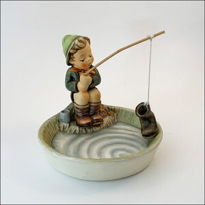 ceramics of little boy holding a fish pole for outdoors Vintage Figurine Boy Fishing