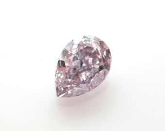 May include: A pear-shaped, light pink diamond with a faceted cut. The diamond is set on a white background.