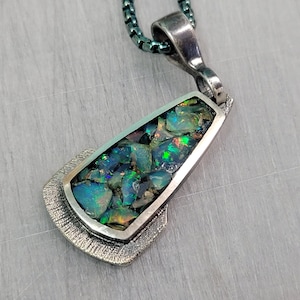 Silver inlaid with opal
