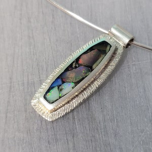 Silver inlaid with opal