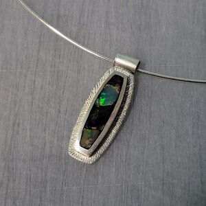 Silver inlaid with opal