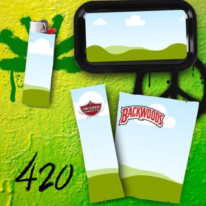 May include: A black rolling tray, a lighter, and two packs of rolling papers are displayed against a green and yellow graffiti background. The lighter and tray feature a landscape design. The rolling papers are branded with the text "Swisher Sweets" and "Backwoods".
