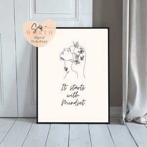 May include: A black and white line drawing of a woman's face with butterflies around her head. The text "It starts with Mindset" is below the drawing.