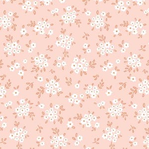 May include: A fabric with a repeating floral pattern. The design features small white flowers and light brown leaves on a light pink background. The fabric is measured in inches.