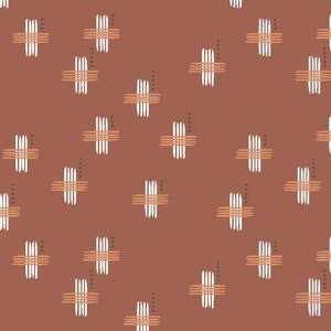 May include: A repeating pattern on a terracotta background. The design features scattered cross-like shapes composed of white and orange-brown parallel lines. Small dots in a darker brown color are also present.