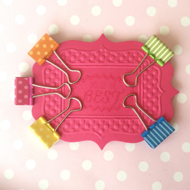 Binder clips. Cute mini coloured foldback clips that are great Etsy