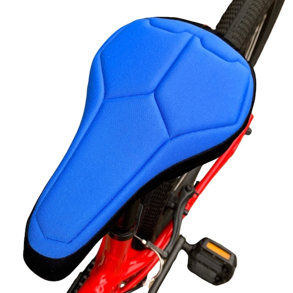 Housse de selle de vélo rembourrée bleue et noire pour enfants en textile respectueux de l'environnement. Mousse de haute technologie pour un soutien maximal et une base résistante à l'eau