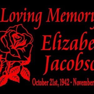 May include: A black background with red text and a red rose graphic. The text reads "In Loving Memory of Elizabeth Jacobson October 21st, 1942 - November 3rd, 2010".