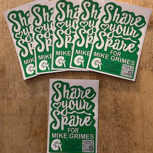 May include: A collection of white rectangular stickers with green text. The stickers read "Share your Spare" with the name "Mike Grimes" and a kidney graphic. A QR code is also included.
