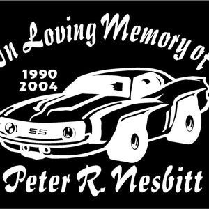 May include: Black and white image of a classic car with the text "In Loving Memory of 1990 2004 Peter R. Nesbitt" on a black background.