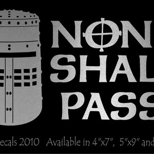 May include: A silver decal with the text "NONE SHALL PASS" and a knight's helmet. The decal is available in sizes 4"x7", 5"x9", and 6.5"x11".