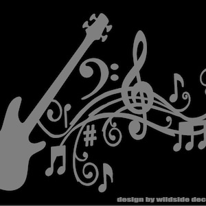 May include: A gray silhouette of a bass guitar with musical notes and a treble clef flowing from the neck of the guitar. The design is on a black background. "design by wildside decals 0621" is written at the bottom of the image.