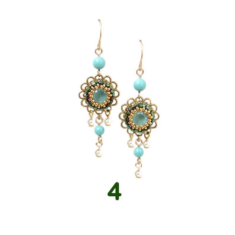 May include: A pair of gold tone earrings with a turquoise and green beaded flower design and a dangling turquoise and white bead drop.