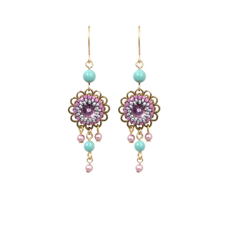 May include: A pair of dangle earrings with a pink and silver beaded flower design, turquoise beads, and gold accents.