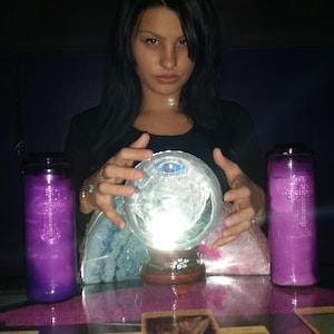 psychic amanda looking at cards and crystal ball