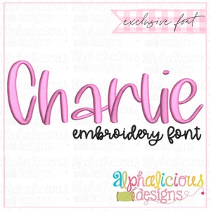May include: Pink embroidery font design for the name "Charlie" with the text "exclusive font" and "embroidery font" in black. The image also includes the text "alphalicious designs" with a pink heart and a spool of thread.