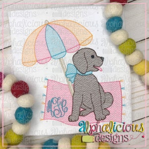 May include: Embroidered design of a brown dog sitting on a pink beach towel with a blue bow. A pink and blue striped umbrella is behind the dog. The design includes the monogram "M.E."