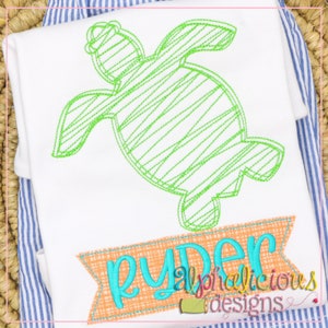 May include: Green embroidered outline of a turtle with a banner below that says "ryder" in turquoise lettering. The banner has a peach background with a woven texture.
