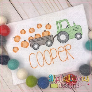 May include: A green tractor pulling a wagon full of orange pumpkins with the name "COOPER" embroidered below.