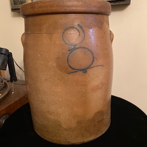 Antique stoneware bee sting butter churn from Red Wing
