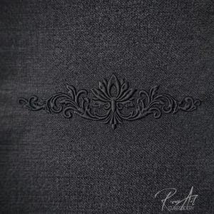 May include: A dark grey fabric with an embossed floral design. The design is centrally placed and features a symmetrical arrangement of leaves and swirls. The bottom right corner has the text "Rious Art EMBROIDERY".