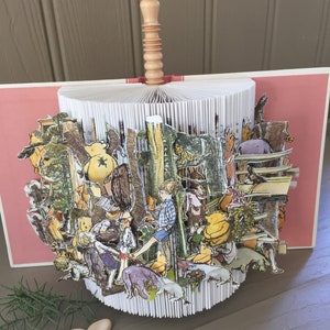 Stories from &#39;Winnie the Pooh&#39; brought to life. A unique book sculpture for young and old