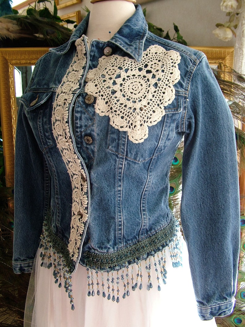 Repurposed denim jacket with added lace decor and fringe
