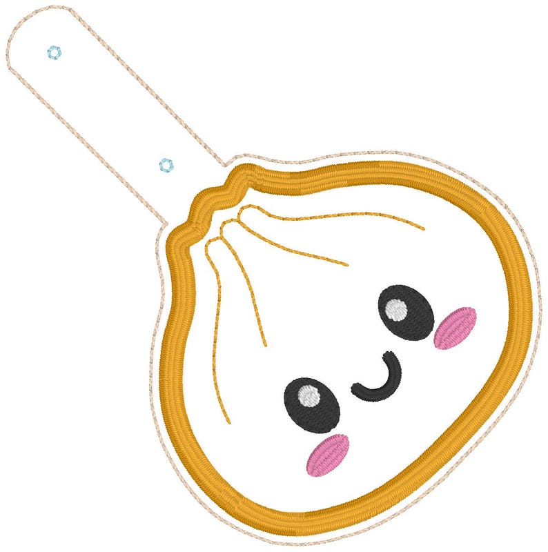 May include: A white embroidered dumpling patch with a golden yellow border and a long tab featuring two small blue eyelets. The dumpling has a smiling face with black oval eyes, a curved black mouth, and two pink oval cheeks stitched onto it.