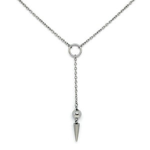 May include: A silver chain necklace with a circle pendant and a pointed, cone-shaped charm at the end.