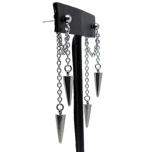 May include: A pair of silver earrings with a chain and three dangling cone-shaped charms.