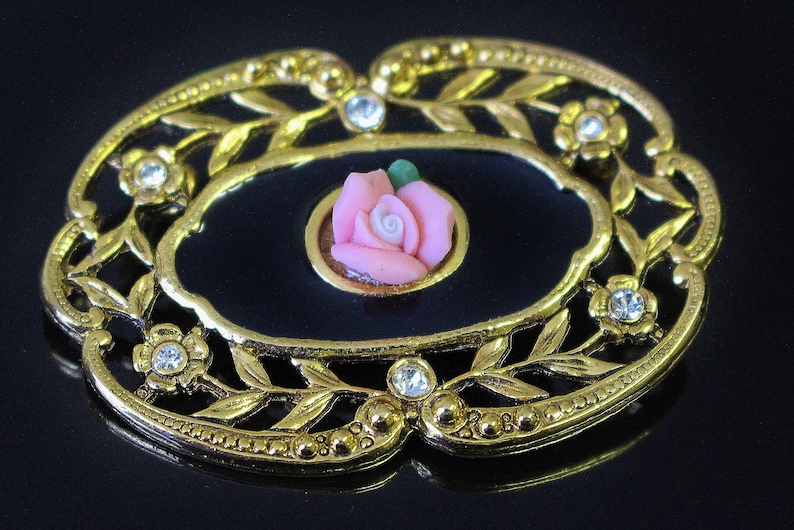 Vintage Oval Brooch Pin Black Enamel with Pink Rosebud Openwork Trailing Flower Stems Frame with Ice Rhinestone Centres with scalloped Rim
