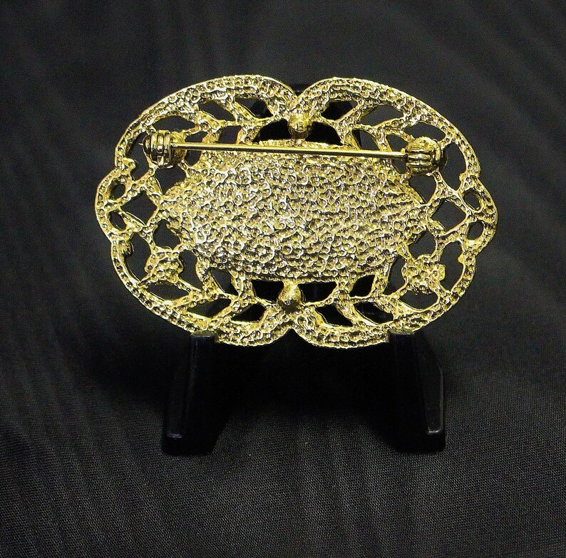 Vintage Oval Brooch Pin Black Enamel with Pink Rosebud Openwork Trailing Flower Stems Frame with Ice Rhinestone Centres with scalloped Rim