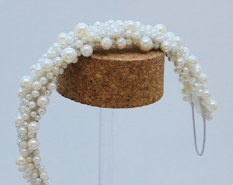 Beautiful  pearl handmade hairband.  Bird cage veil option available.