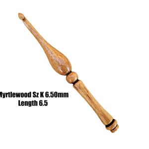 May include: A wooden crochet hook with a brown and black finish. The hook is size K 6.50mm and 6.5 inches long. Myrtlewood Sz K 6.50mm Length 6.5