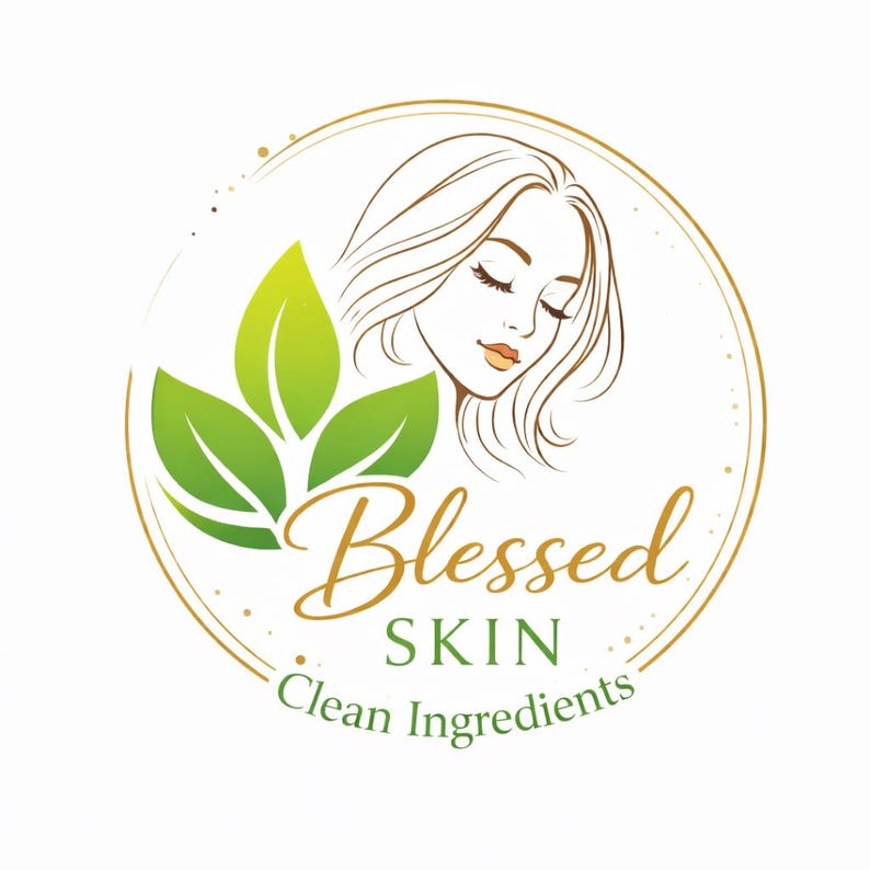 May include: A circular logo with a woman's face, green leaves, and the words "Blessed SKIN Clean Ingredients" in gold and white. The woman has closed eyes and flowing hair, surrounded by a gold outline.