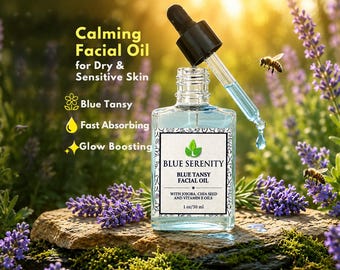 May include: A clear glass bottle of Blue Serenity Blue Tansy Facial Oil with a dropper, set against a backdrop of lavender and greenery. The label indicates it's for dry and sensitive skin, fast absorbing, and glow boosting. The bottle contains 1 oz / 30 ml.