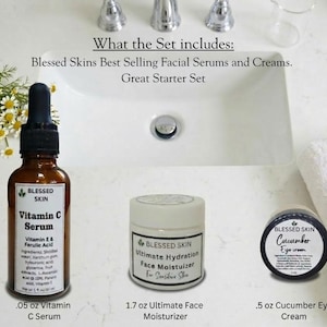 May include: A skincare set featuring a brown glass bottle of Vitamin C Serum, a white jar of Ultimate Face Moisturizer, and a small black jar of Cucumber Eye Cream. The set includes .05 oz Vitamin C Serum, 1.7 oz Ultimate Face Moisturizer, and .5 oz Cucumber Eye Cream.