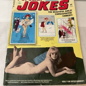 May include: A vintage magazine titled "Popular Jokes" with a yellow cover. The cover features illustrations of women and text, including "Cartoon Laugh Riot!" and "Adult Fun Entertainment!" A nude woman is lying on a green couch.
