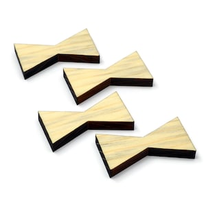 May include: Four wooden bow tie shapes in a staggered pattern. The bow ties are light brown with dark brown edges.